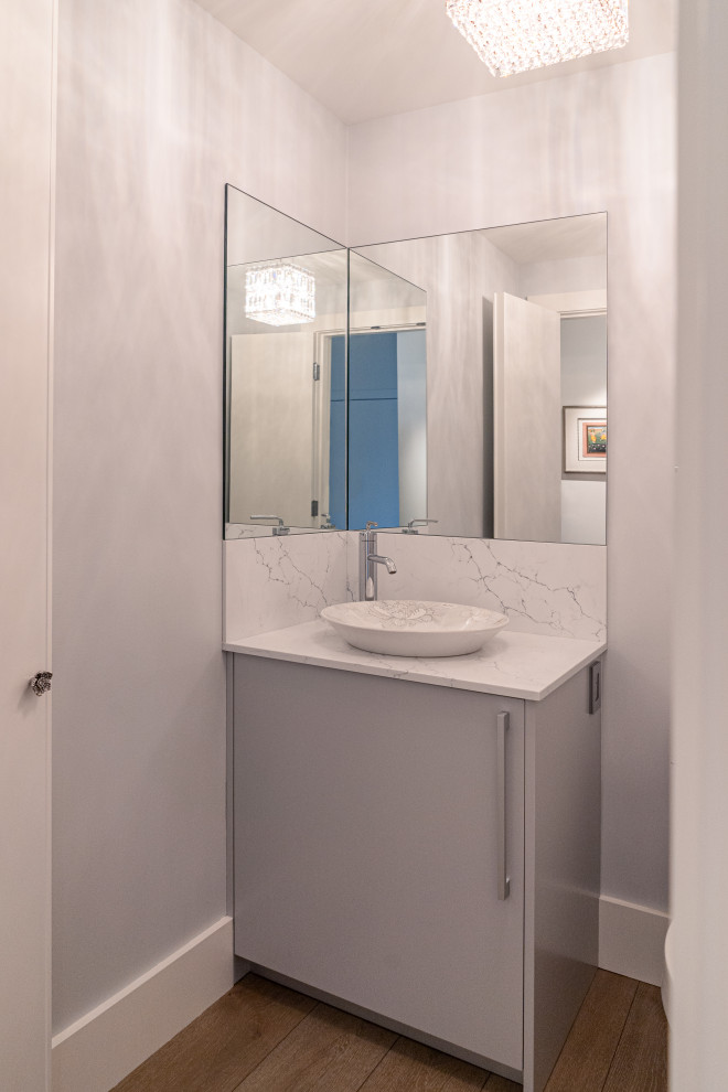 Medium sized contemporary shower room bathroom in Portland with flat-panel cabinets, grey cabinets, a one-piece toilet, white walls, medium hardwood flooring, a vessel sink, engineered stone worktops, brown floors, white worktops, a single sink and a built in vanity unit.
