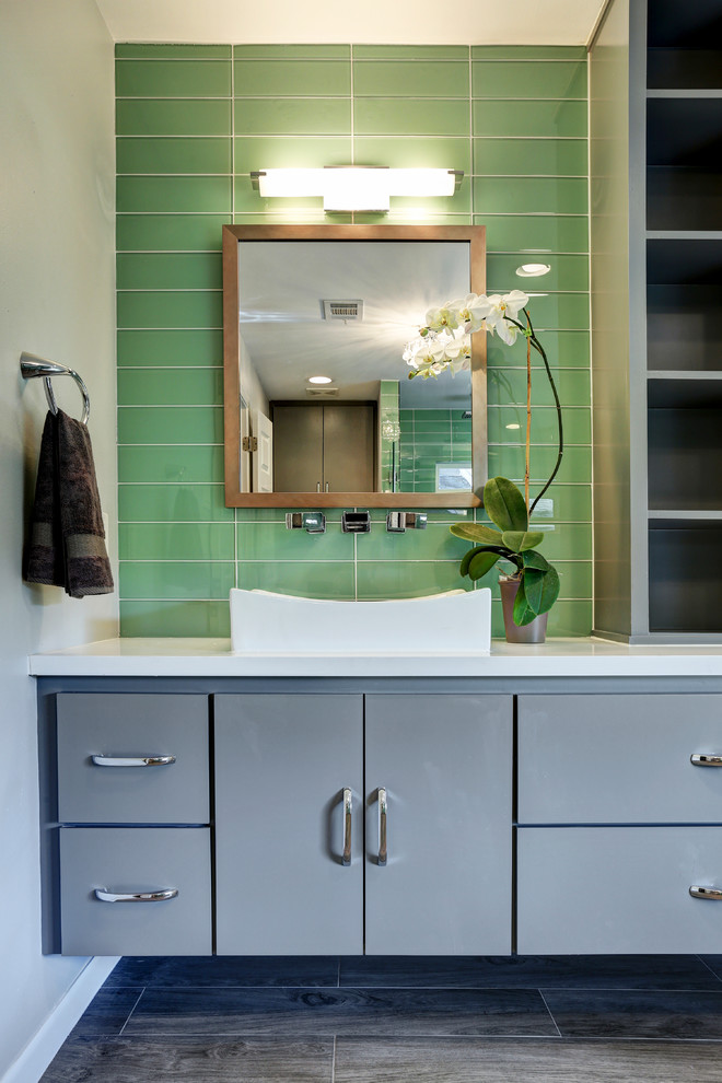Example of a mid-sized trendy master green tile and glass tile dark wood floor bathroom design in Houston with a console sink, flat-panel cabinets, gray cabinets, quartz countertops, a one-piece toilet and white walls