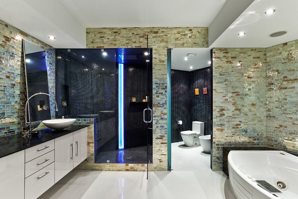 Example of a large master mosaic tile bathroom design in Miami with a vessel sink and a hot tub