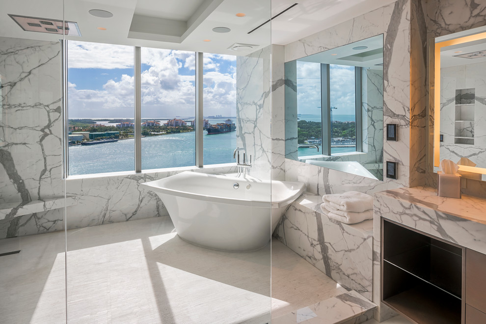 This is an example of a contemporary grey and white bathroom in Miami with an open shower.
