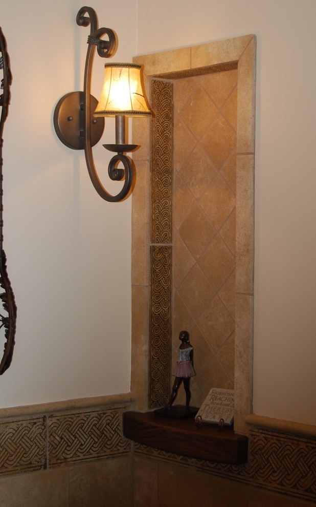 Bathroom - huge mediterranean master beige tile limestone floor bathroom idea in Sacramento with furniture-like cabinets, medium tone wood cabinets, marble countertops and beige walls