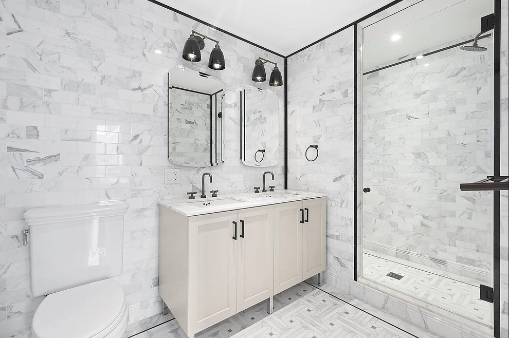Design ideas for a medium sized contemporary shower room bathroom in Chicago with recessed-panel cabinets, beige cabinets, an alcove shower, a two-piece toilet, grey tiles, marble tiles, grey walls, marble flooring, a submerged sink, marble worktops, grey floors, a hinged door and grey worktops.