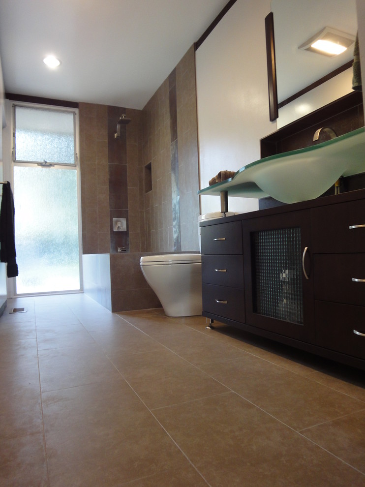 Mid-sized 1950s master multicolored tile and ceramic tile ceramic tile bathroom photo in Los Angeles with flat-panel cabinets, dark wood cabinets, a one-piece toilet, white walls, an integrated sink and glass countertops