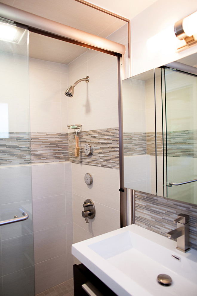 This is an example of a small traditional bathroom in San Francisco with flat-panel cabinets, dark wood cabinets, an alcove bath, an alcove shower, a two-piece toilet, grey tiles, stone tiles, white walls, porcelain flooring, an integrated sink and engineered stone worktops.