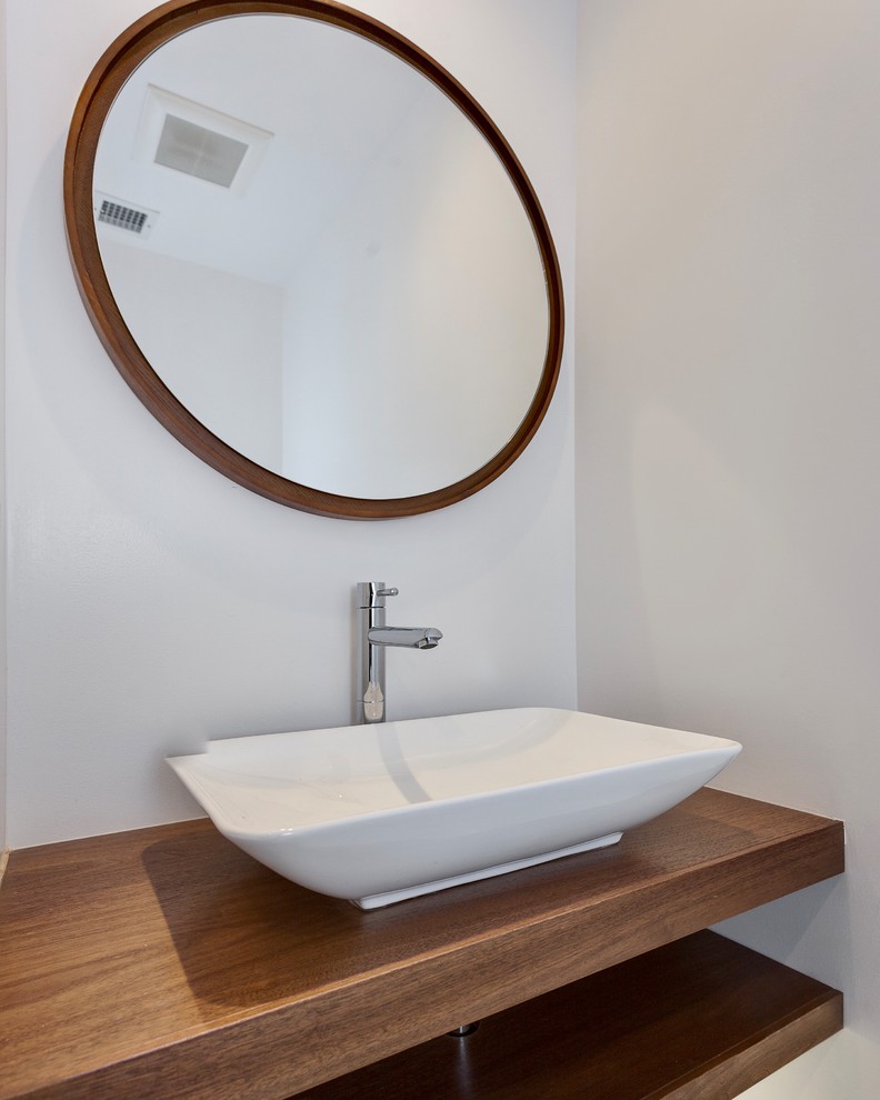 Inspiration for a small mid-century modern bathroom remodel in Los Angeles with open cabinets, medium tone wood cabinets, white walls and a vessel sink