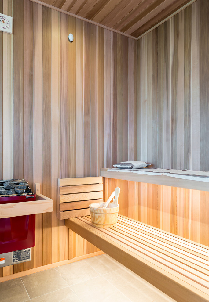 Immagine di un'ampia stanza da bagno padronale moderna con vasca freestanding, doccia doppia, pareti marroni, pavimento in gres porcellanato, pavimento grigio e porta doccia a battente