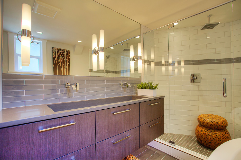 Example of a minimalist master white tile and glass tile porcelain tile bathroom design in Seattle with flat-panel cabinets, medium tone wood cabinets, quartz countertops, a two-piece toilet, an integrated sink and white walls