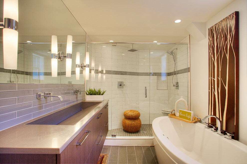 Example of a mid-sized minimalist master ceramic tile and white tile porcelain tile bathroom design in Seattle with quartz countertops, dark wood cabinets, flat-panel cabinets, a two-piece toilet, an integrated sink and gray walls