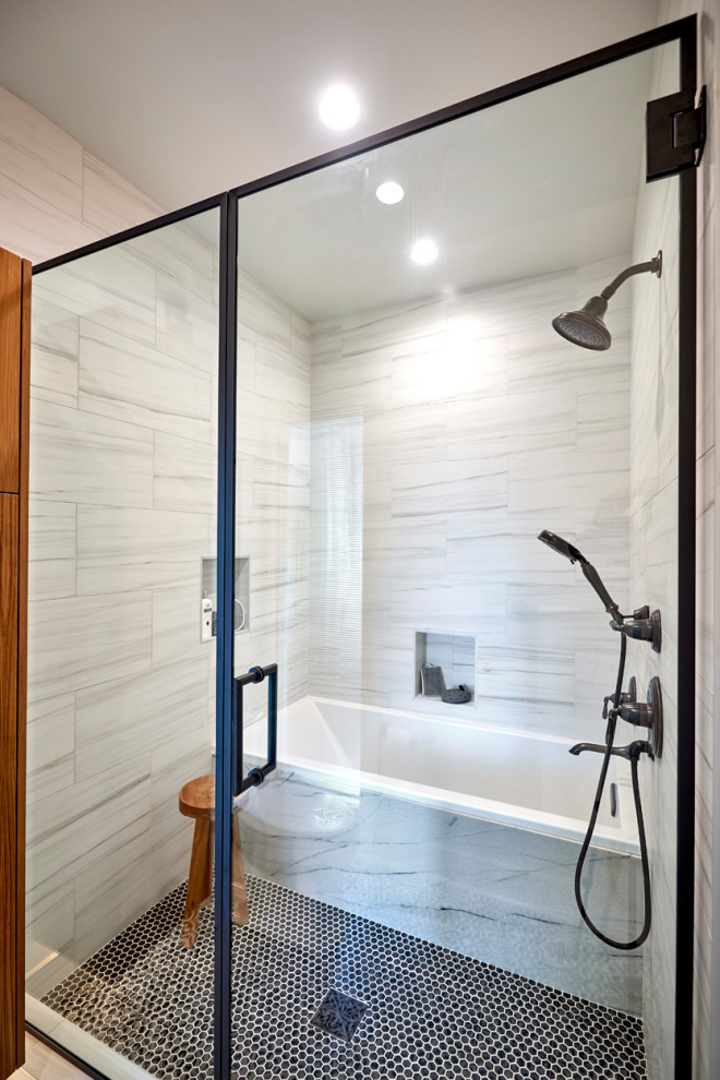 Example of a mid-sized 1960s master black and white tile and porcelain tile cement tile floor, black floor, double-sink and shiplap wall bathroom design in Denver with flat-panel cabinets, medium tone wood cabinets, a one-piece toilet, white walls, a vessel sink, quartzite countertops, a hinged shower door, white countertops, a niche and a floating vanity