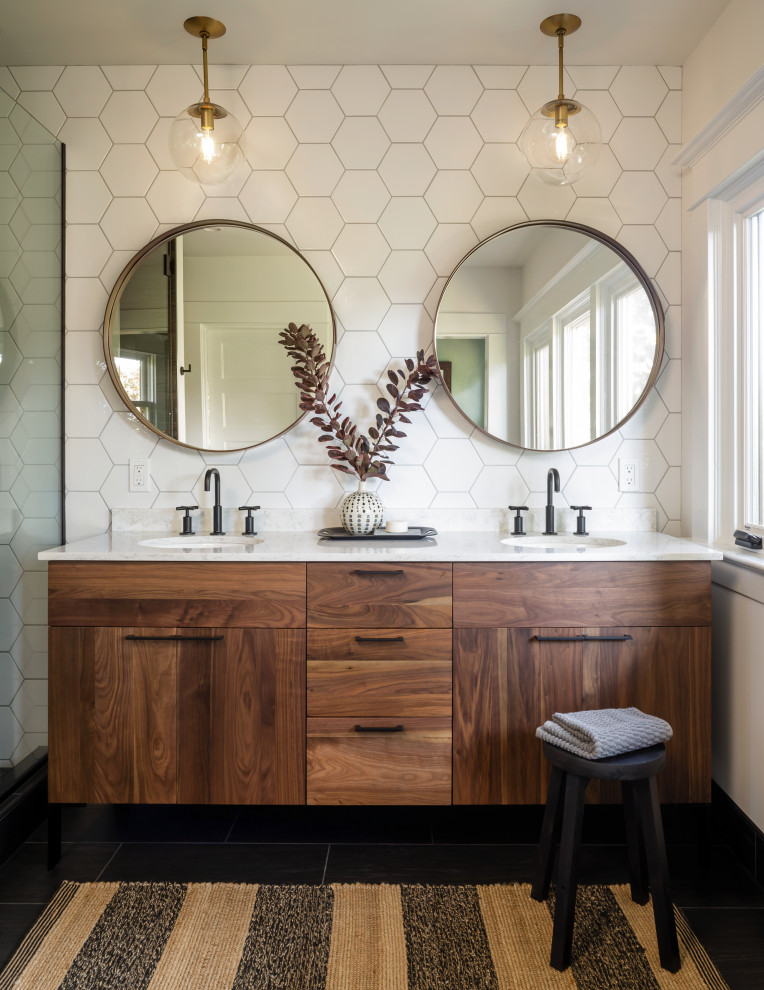Bathroom - mid-sized mid-century modern master white tile and ceramic tile porcelain tile, black floor and double-sink bathroom idea in Portland with medium tone wood cabinets, white walls, an undermount sink, quartz countertops, a hinged shower door, white countertops, a niche and a freestanding vanity