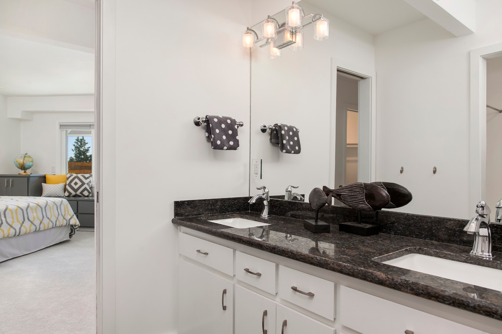 Example of a mid-sized mid-century modern master bathroom design in Seattle with flat-panel cabinets, white cabinets, white walls, an undermount sink and granite countertops