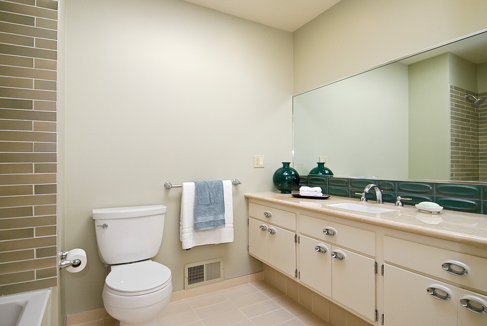 Example of a master green tile and ceramic tile ceramic tile bathroom design in San Francisco with flat-panel cabinets, white cabinets, beige walls, a drop-in sink and marble countertops