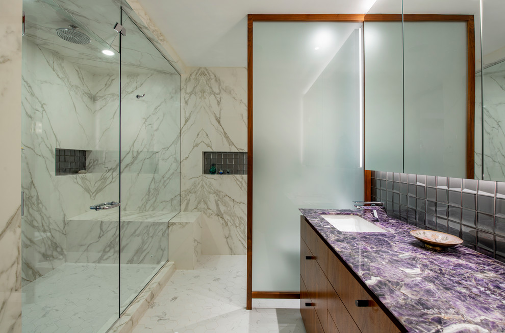 This is an example of a medium sized retro ensuite bathroom in Other with flat-panel cabinets, medium wood cabinets, a double shower, a one-piece toilet, white tiles, marble tiles, white walls, marble flooring, a submerged sink, quartz worktops, white floors, a hinged door and purple worktops.