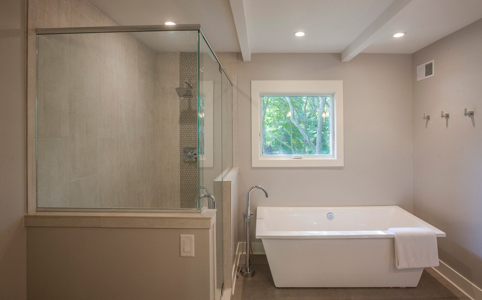 Midcentury bathroom in Grand Rapids with a freestanding bath, a corner shower, grey tiles, ceramic tiles, grey walls and ceramic flooring.