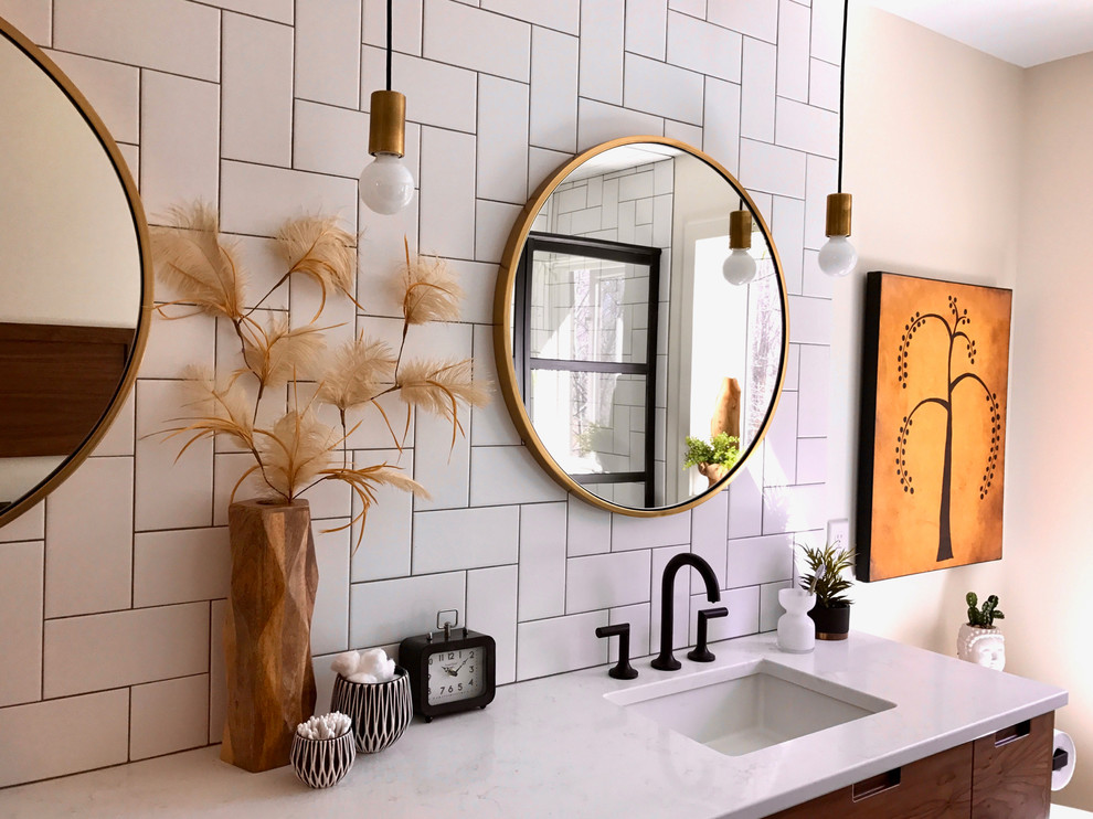 Bathroom - mid-sized modern master white tile and subway tile bathroom idea in Grand Rapids with flat-panel cabinets, medium tone wood cabinets, white walls, an undermount sink, marble countertops and white countertops