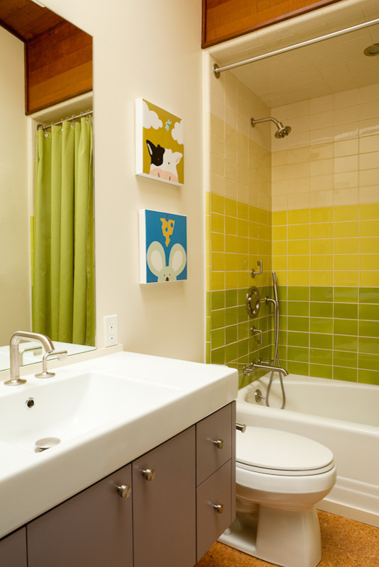 Large modern family bathroom in San Francisco with flat-panel cabinets, white walls, cork flooring, solid surface worktops, an alcove bath, a shower/bath combination, a one-piece toilet, green tiles, metro tiles and a console sink.