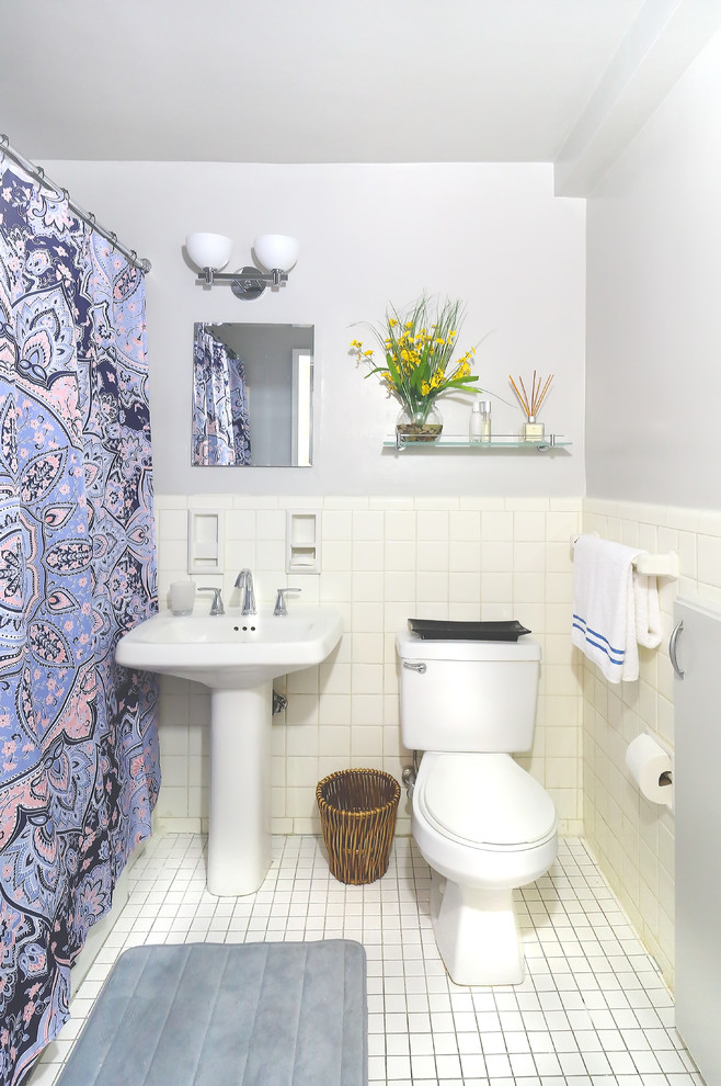 This is an example of a small midcentury shower room bathroom in New York with open cabinets, white cabinets, an alcove bath, a shower/bath combination, a two-piece toilet, white tiles, ceramic tiles, grey walls, ceramic flooring, a pedestal sink, white floors, a shower curtain and white worktops.