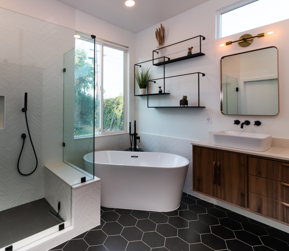 Example of a mid-century modern black and white tile and porcelain tile porcelain tile, black floor and double-sink bathroom design in Orange County with flat-panel cabinets, brown cabinets, white walls, a vessel sink, quartz countertops, a hinged shower door, white countertops and a floating vanity