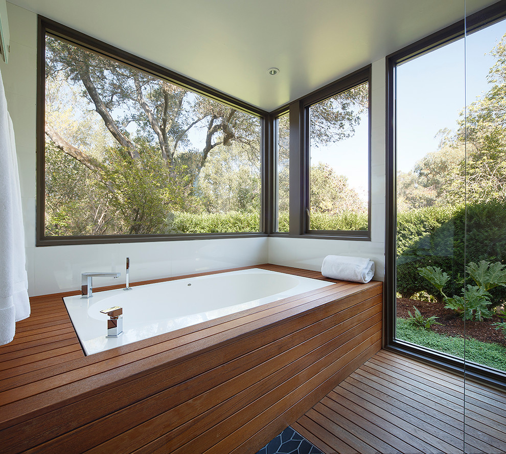 Inspiration for a large mid-century modern master medium tone wood floor wet room remodel in San Francisco with flat-panel cabinets, light wood cabinets, an undermount tub, white walls, an undermount sink and marble countertops