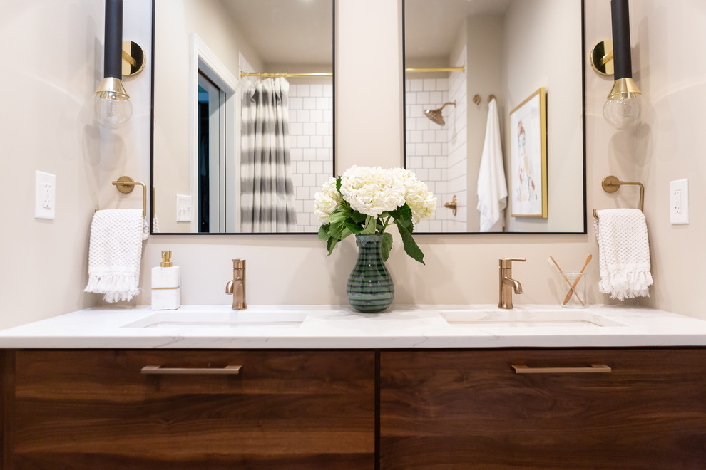 Medium sized midcentury shower room bathroom in DC Metro with flat-panel cabinets, dark wood cabinets, an alcove shower, a two-piece toilet, white tiles, metro tiles, beige walls, a submerged sink, marble worktops, blue floors, a shower curtain and white worktops.