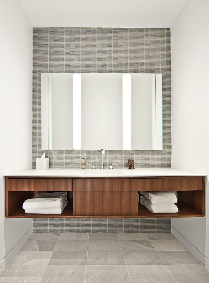 Example of an urban gray tile bathroom design in Chicago with open cabinets and dark wood cabinets