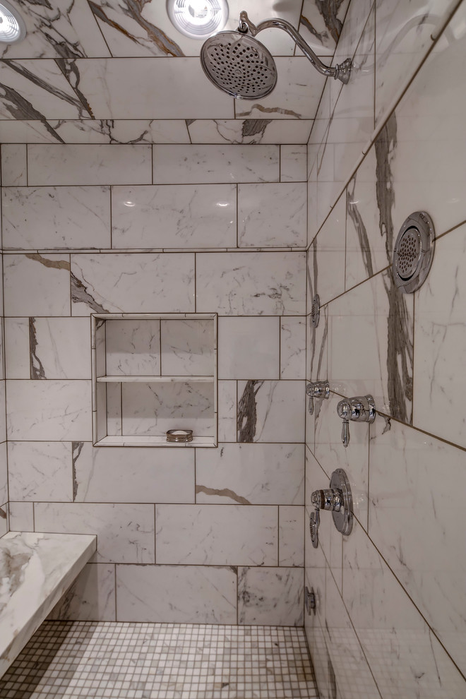 Example of a large transitional master white tile and stone tile marble floor bathroom design in Omaha with an undermount sink, recessed-panel cabinets, white cabinets, marble countertops, a two-piece toilet and white walls