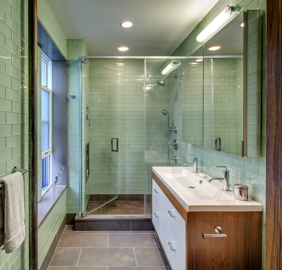 Design ideas for a medium sized retro shower room bathroom in Other with a trough sink, an alcove shower, flat-panel cabinets, white cabinets, green tiles, glass tiles and green walls.