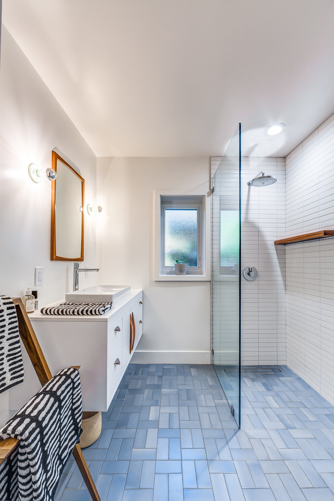 Example of a mid-sized mid-century modern 3/4 white tile and ceramic tile ceramic tile and blue floor bathroom design in San Francisco with flat-panel cabinets, white cabinets, white walls, a vessel sink, quartz countertops and white countertops