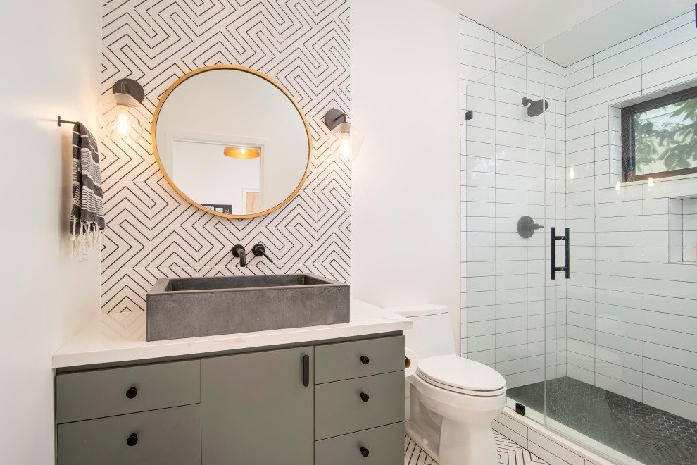 Inspiration for a medium sized contemporary shower room bathroom in Orange County with flat-panel cabinets, grey cabinets, an alcove shower, white tiles, cement tiles, white walls, cement flooring, a trough sink, engineered stone worktops, white floors, a hinged door and white worktops.