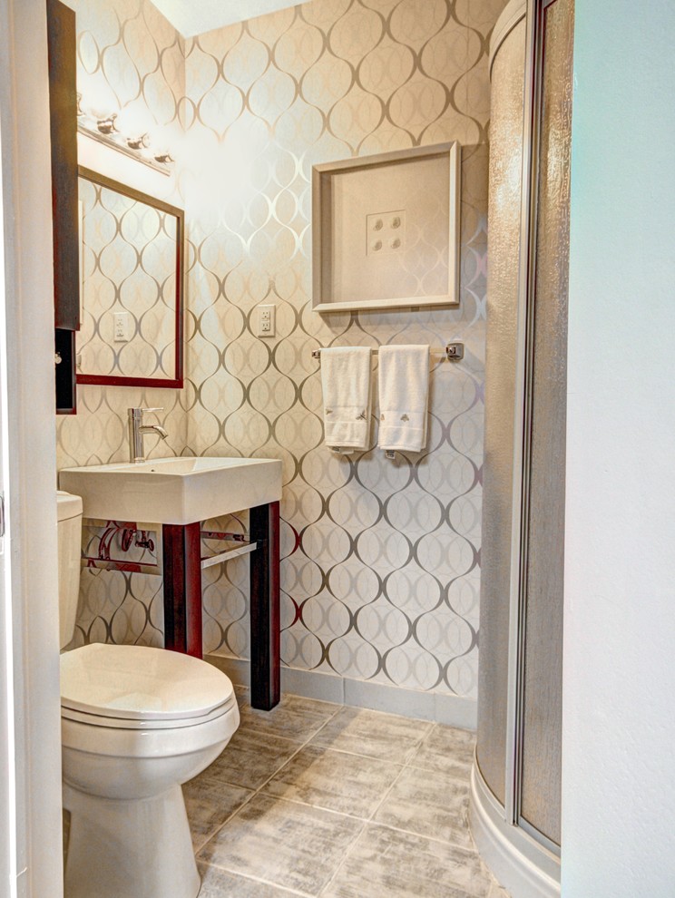 Photo of a small contemporary shower room bathroom in Montreal with a pedestal sink, a corner shower, a one-piece toilet, grey tiles, ceramic tiles and ceramic flooring.