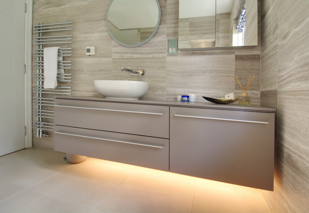 Small contemporary bathroom in Hampshire with flat-panel cabinets, brown cabinets, a wall mounted toilet, brown tiles, limestone tiles, porcelain flooring, a console sink, laminate worktops, brown floors, an open shower, brown worktops, a wall niche, a single sink and a floating vanity unit.
