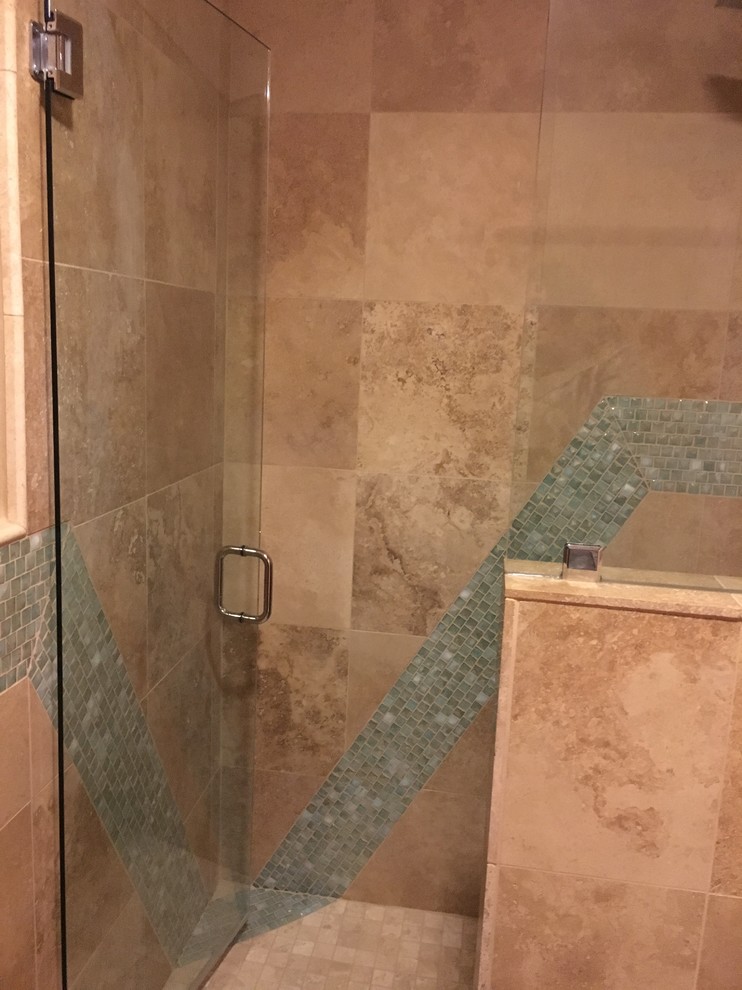 Inspiration for a mid-sized mediterranean 3/4 green tile and glass tile travertine floor and beige floor alcove shower remodel in Other with raised-panel cabinets, brown cabinets, a two-piece toilet, orange walls, an undermount sink, quartz countertops and a hinged shower door