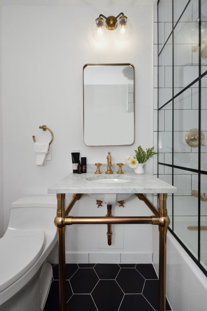 Inspiration for a small traditional shower room bathroom in New York with open cabinets, grey cabinets, a built-in bath, a walk-in shower, a one-piece toilet, white tiles, white walls, ceramic flooring, a submerged sink, marble worktops, black floors, grey worktops, a single sink and a freestanding vanity unit.