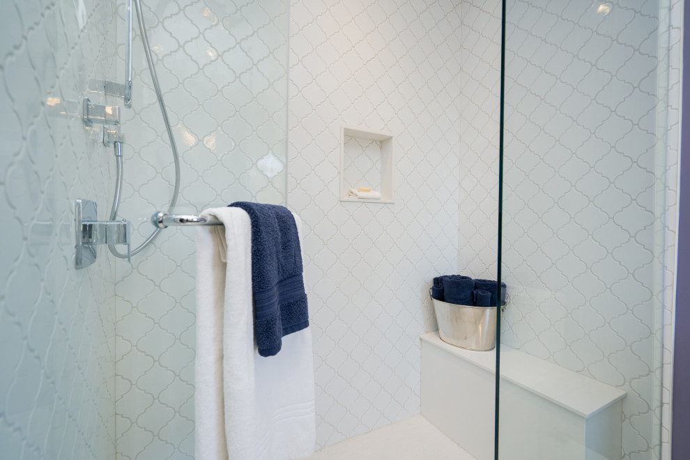Example of a transitional master white tile and porcelain tile porcelain tile, white floor and single-sink bathroom design in Toronto with shaker cabinets, blue cabinets, a one-piece toilet, purple walls, an undermount sink, quartz countertops, a hinged shower door, white countertops and a built-in vanity