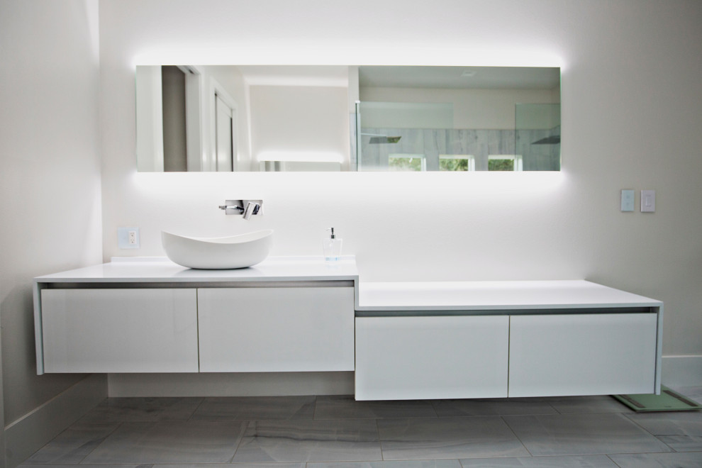 Design ideas for a large modern ensuite bathroom in Miami with flat-panel cabinets, white cabinets, white walls, ceramic flooring, a pedestal sink, quartz worktops, white floors, white worktops, a single sink and a floating vanity unit.