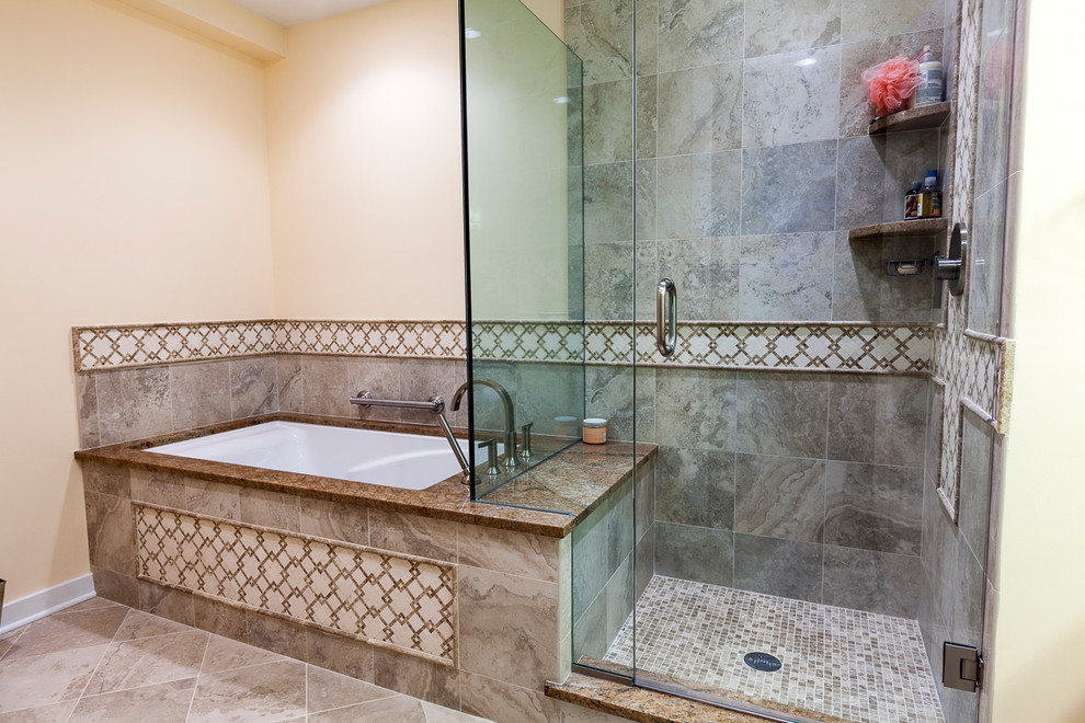 Example of a small classic master gray tile and porcelain tile porcelain tile and beige floor corner shower design in Bridgeport with raised-panel cabinets, brown cabinets, an undermount tub, a two-piece toilet, beige walls, an undermount sink, granite countertops and a hinged shower door