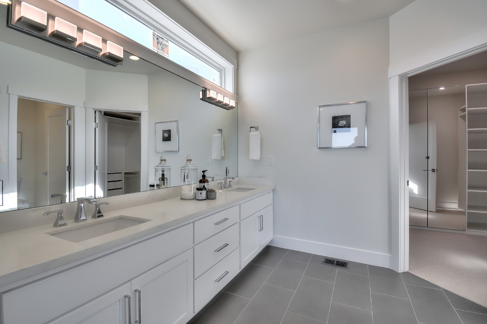 This is an example of a large modern ensuite bathroom in San Francisco with shaker cabinets, white cabinets, grey walls, slate flooring, a submerged sink, quartz worktops, grey floors and white worktops.