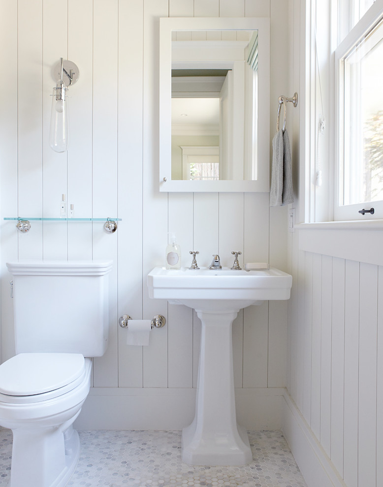 Elegant white tile bathroom photo in San Francisco with a pedestal sink and a two-piece toilet