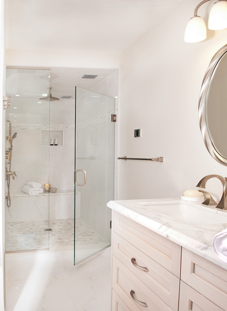 Double shower - large transitional master white tile and porcelain tile porcelain tile double shower idea in Toronto with an undermount sink, furniture-like cabinets, light wood cabinets, marble countertops, a two-piece toilet and gray walls
