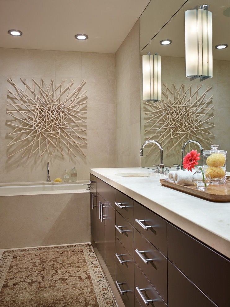Inspiration for a contemporary beige tile bathroom remodel in Seattle with an undermount sink, flat-panel cabinets, brown cabinets and an undermount tub