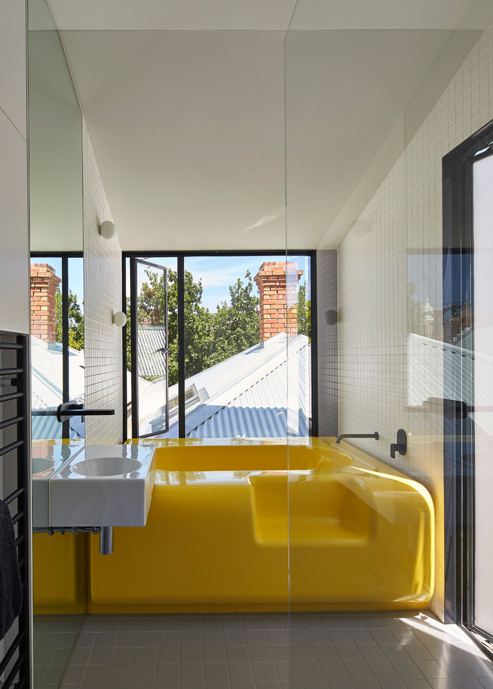 Contemporary grey and yellow bathroom in Melbourne.