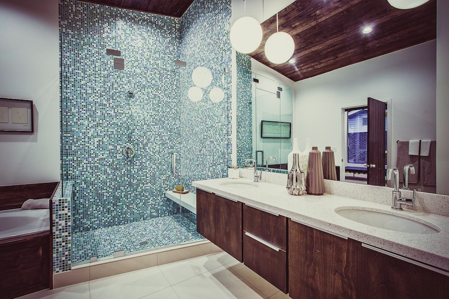 Example of a mid-century modern master blue tile and mosaic tile double-sink and wood ceiling bathroom design in Salt Lake City with flat-panel cabinets, dark wood cabinets, yellow walls, a hinged shower door and a floating vanity