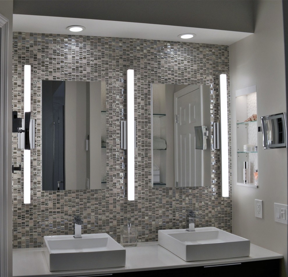 Example of a mid-sized minimalist master gray tile and porcelain tile porcelain tile and white floor bathroom design in Other with flat-panel cabinets, brown cabinets, a one-piece toilet, gray walls, a vessel sink, quartz countertops, a hinged shower door and white countertops