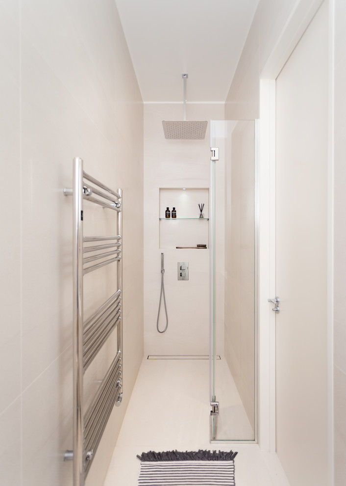 Small trendy beige tile beige floor walk-in shower photo in London with beige walls and a hinged shower door