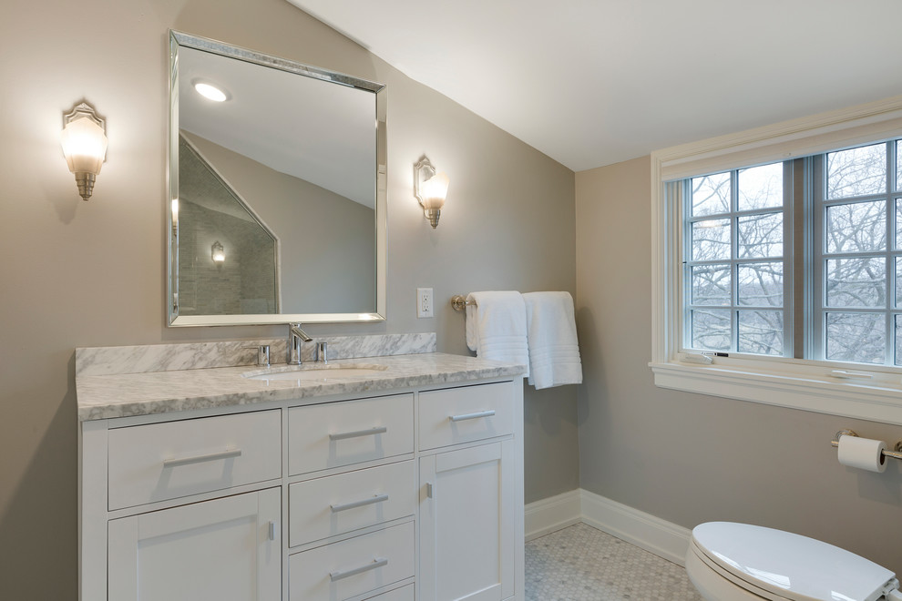 Inspiration for a mid-sized timeless porcelain tile wet room remodel in Minneapolis with shaker cabinets, white cabinets, a one-piece toilet, gray walls, an undermount sink and marble countertops