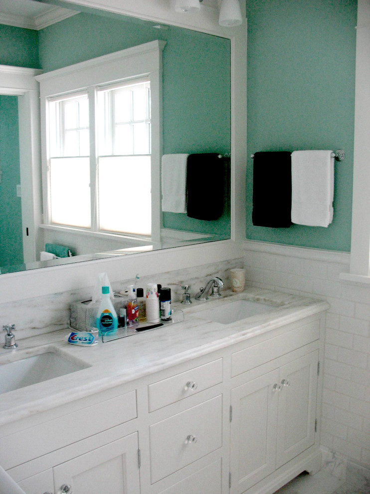 Example of a transitional bathroom design in Philadelphia with shaker cabinets, white cabinets, blue walls, an undermount sink and marble countertops