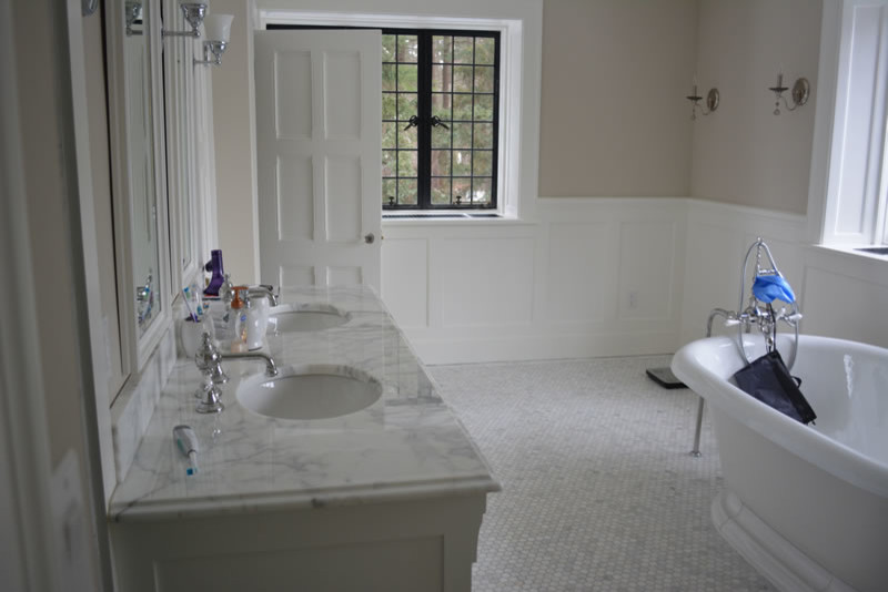 Inspiration for a large contemporary master white tile and ceramic tile ceramic tile bathroom remodel in Boston with a drop-in sink, flat-panel cabinets, white cabinets, marble countertops, a two-piece toilet and white walls