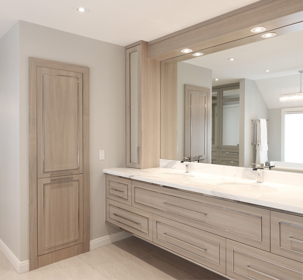 Inspiration for a large contemporary ensuite bathroom in Calgary with beaded cabinets, light wood cabinets, a claw-foot bath, a corner shower, grey tiles, marble tiles, grey walls, porcelain flooring, a submerged sink, engineered stone worktops, beige floors and a hinged door.