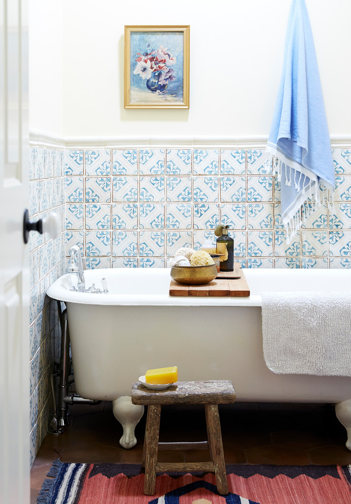 Medium sized bohemian bathroom in San Francisco with open cabinets, light wood cabinets, a claw-foot bath, white tiles, terracotta tiles, terracotta flooring, marble worktops, brown floors and white worktops.