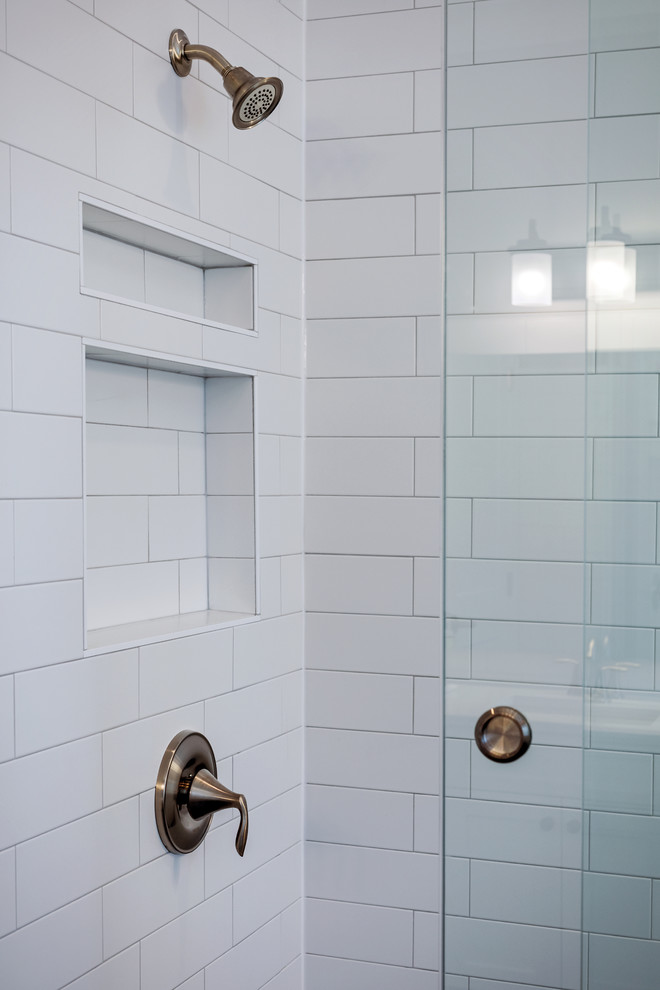 Inspiration for a mid-sized timeless master white tile and subway tile ceramic tile and black floor bathroom remodel in Other with shaker cabinets, white cabinets, a two-piece toilet, blue walls, an undermount sink, quartzite countertops and white countertops